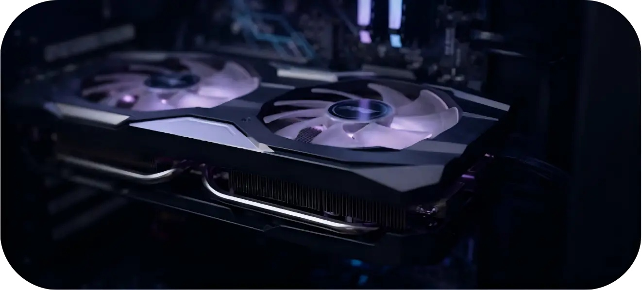 A close-up macro shot of a sleek graphics card with faint purple LED lighting under its fans.