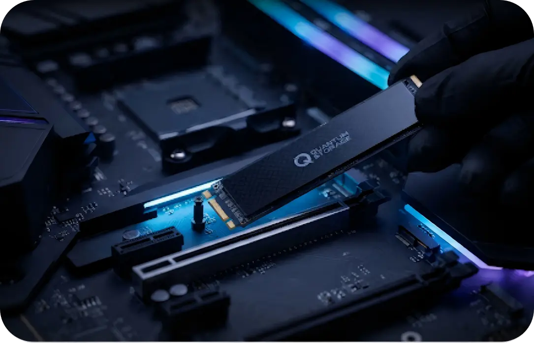 A close-up of a high-speed NVMe M.2 SSD being installed into a motherboard slot.